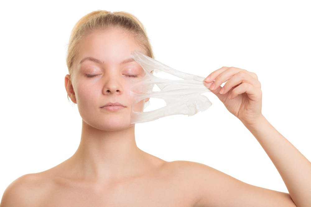 girl removing facial peel off mask Chemical Peels2